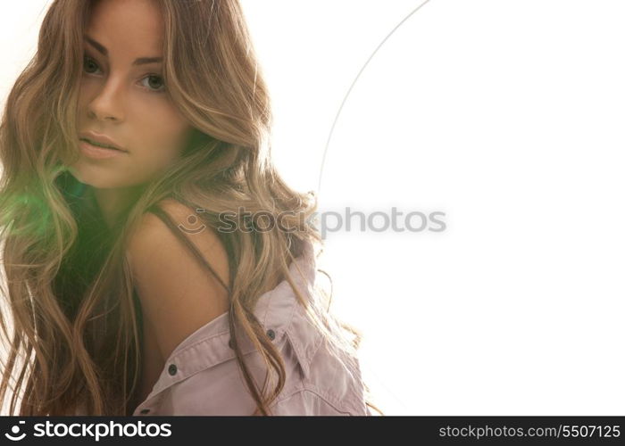 soft focus backlight picture of beautiful woman with green lens flare