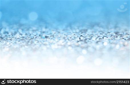 Soft focus blur Abstract light blink sparkle backgound. Blue glitter shine dots confetti.