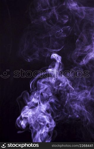 soft focus smoke swirling black background