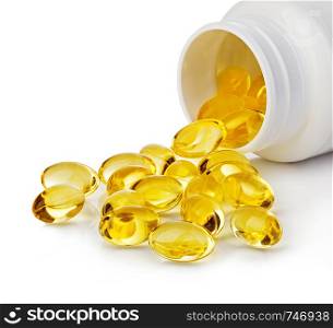 Soft gels pills with Omega-3 oil spilling out of pill bottle close-up isolated on a white background.