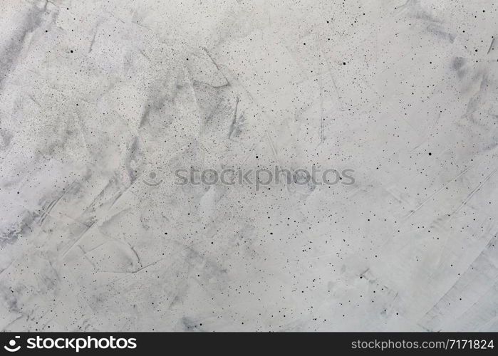 Soft lighting a light gray concrete background with spotted stripes and speckled, soft lighting.. Light gray concrete background with spotted stripes and speckled.