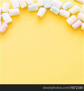 soft marshmallows edge yellow background. High resolution photo. soft marshmallows edge yellow background. High quality photo