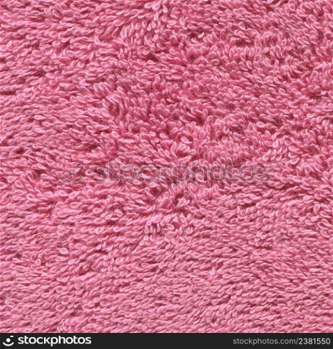 Soft pink texture of towel. Pink towel texture. Cotton towel background and texture. Pink color bath towel texture. Pink cloth bath towel background.
