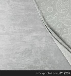 soft towel in a grey  decorative stucco background. top view, isolated. a towel on gray background