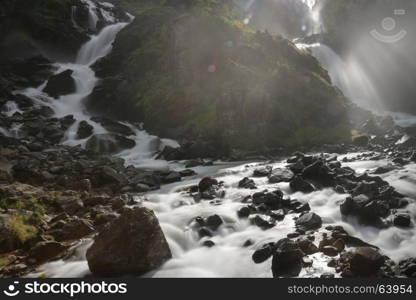 Soft water of the rough Latefossen falls in Odda Norway