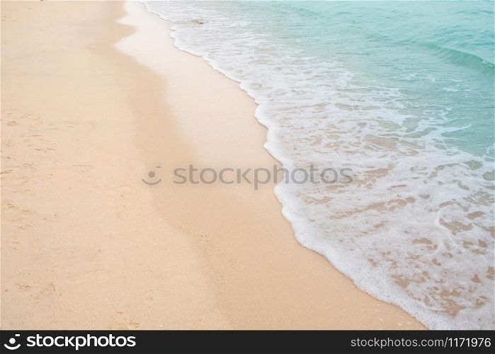 Soft wave of sea on empty sandy beach Background with copy space