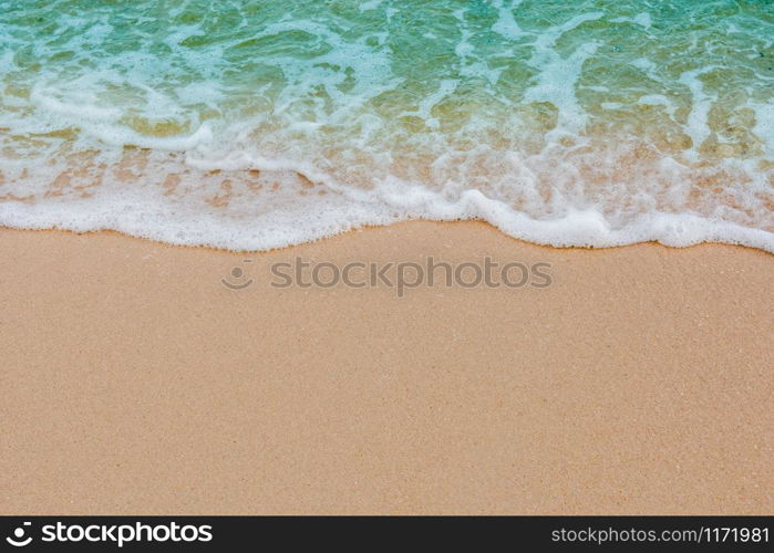 Soft wave of sea on empty sandy beach Background with copy space