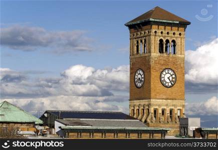 Soft white clouds surround the old City Hall Building in Tacoma Washington, United States