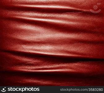 Soft wrinkled red leather. Texture or background with copyspace, high resolution