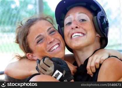 Softball Teammates Hugging Each Other And Laughing