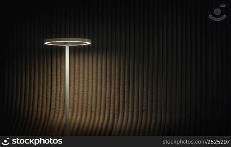 Softly shining desk lamp design placed against a dark background. Table lamp decor for bedroom, Copy space, Selective focus.