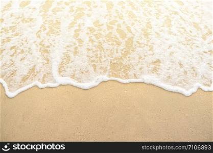 softly wave on the sand beach sunset