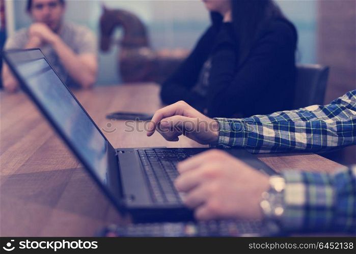 software developer writing programming code on laptop computer