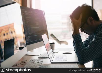 Software developers headache with code analysis in the office.