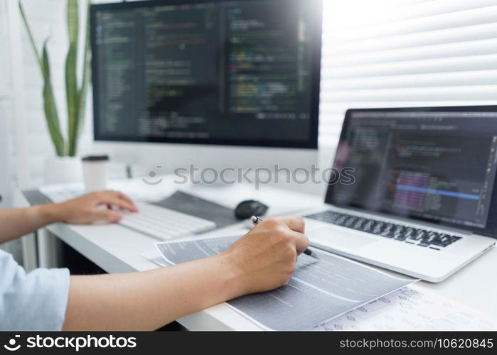 Software development concept, Male programmer pointing on data code to checking website programming.