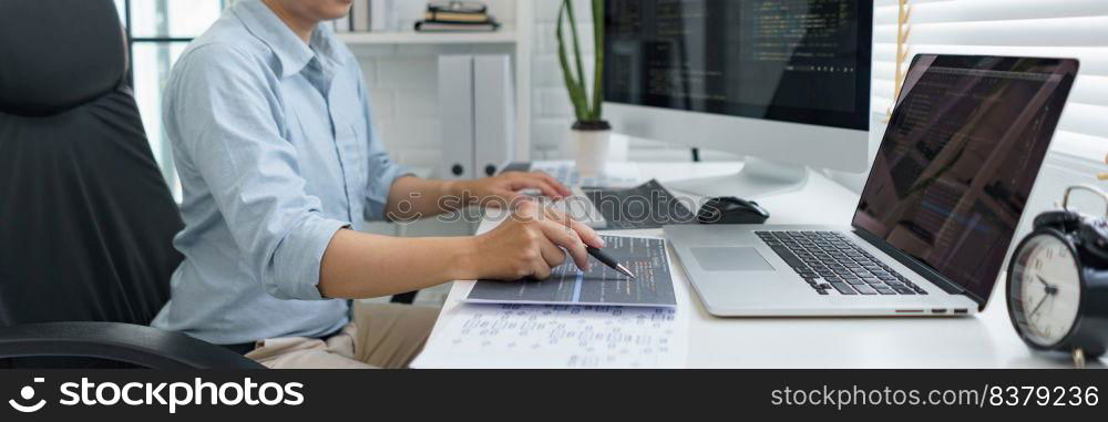 Software development concept, Male programmer pointing on data code to checking website programming.