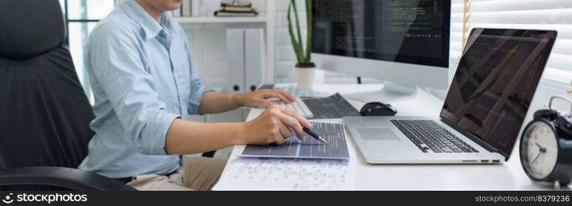 Software development concept, Male programmer pointing on data code to checking website programming.