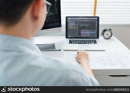 Software development concept, Male programmer typing data code on laptop to develop app and website.