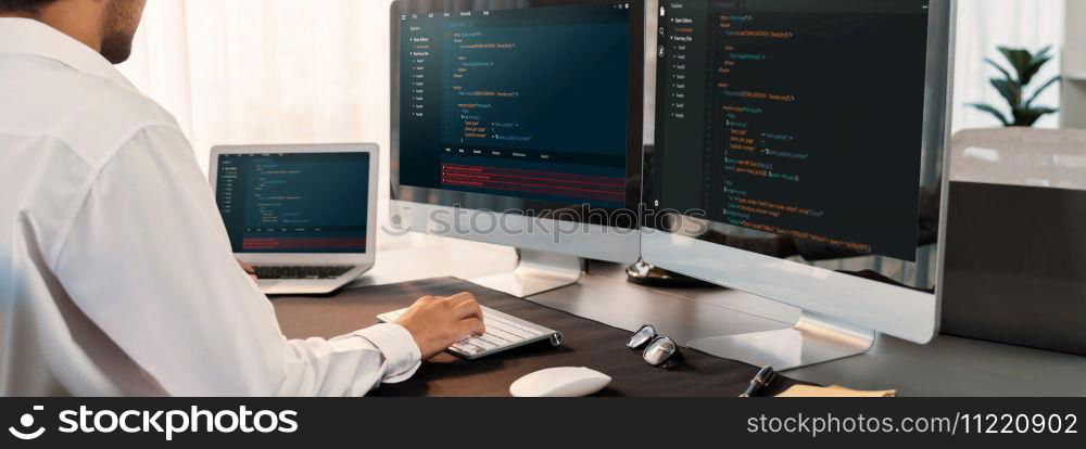 Software engineer working on application development on his computer display code and script on monitor at tech company office workplace. Application developer solving and writing code. Trailblazing. Application developer solving and writing code. Trailblazing