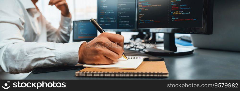 Software engineer working on application development on his computer display code and script on monitor at tech company office workplace. Application developer solving and writing code. Trailblazing. Application developer solving and writing code. Trailblazing
