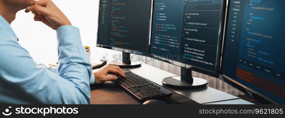 Software engineer working on application development on his computer display code and script on monitor at tech company office workplace. Application developer solving and writing code. Trailblazing. Application developer solving and writing code. Trailblazing