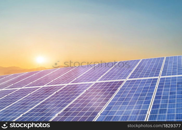 Solar panel against sunset background. Photovoltaic, alternative electricity source. Idea for sustainable resources