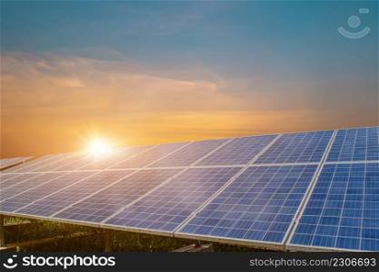 Solar panel at beautiful sunset sky background. Photovoltaic, alternative electricity source