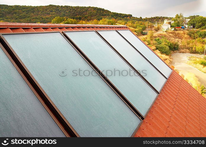 Solar panel (geliosystem) on the house roof.