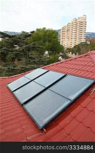 Solar panel (geliosystem) on the red roof.