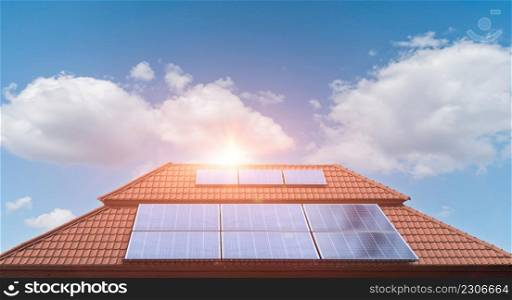 Solar panel on a roof of a house with blue sky cloud background. Photovoltaic, alternative electricity source. sustainable resources