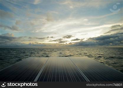 solar panel, photovoltaic alternative electricity with sea and sky background