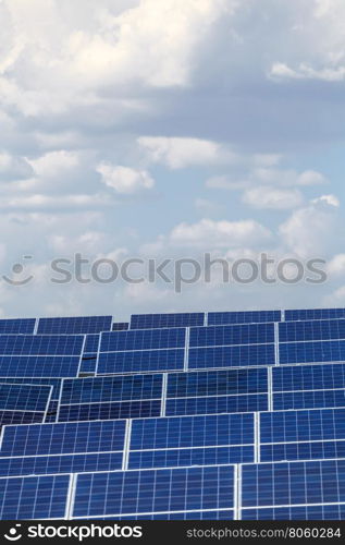 solar panels against the sky. elements of solar power plants against the sky with clouds