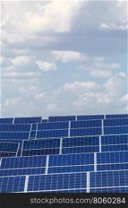 solar panels against the sky. elements of solar power plants against the sky with clouds