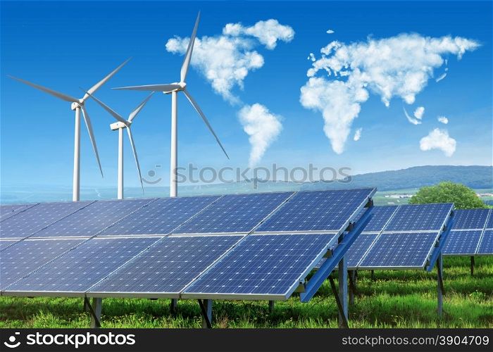 solar panels and wind turbines under blue sky with world map made of clouds. solar panels and wind turbines with world map