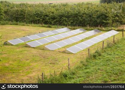 solar panels in the grass of a garden in the netherlands