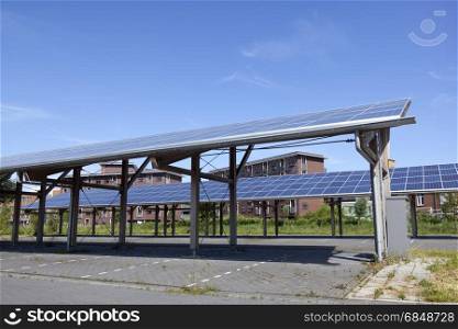 solar panels on roof of car parking at water campus leeuwarden in the netherlands under blue sky
