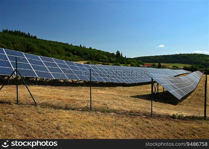 Solar power plant - concept for electricity and ecological industry. High energy prices. Beautiful landscape and sunny day with blue sky. Photovoltaic power plant.