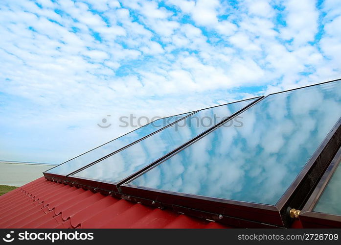 Solar system on the red house roof