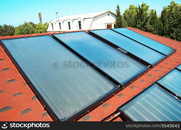 Solar water heating panels on the red roof. Gelio system