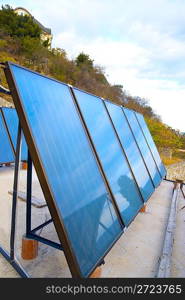 Solar water heating system on the house roof.