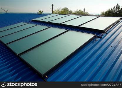 Solar water heating system on the house roof.