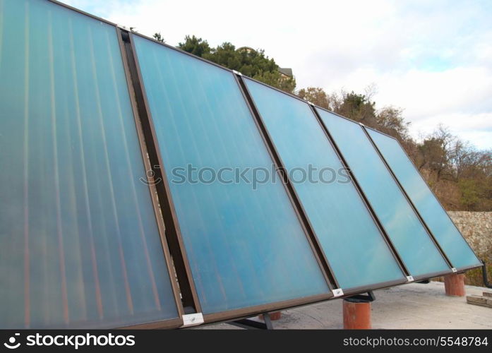 Solar water heating system on the house roof.