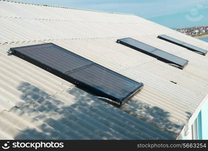 Solar water heating system on the house roof.