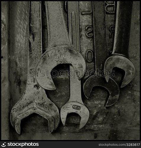 Solarized crescent wrenches on metal.