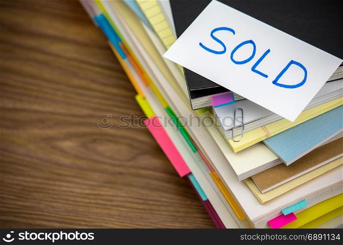 Sold; The Pile of Business Documents on the Desk