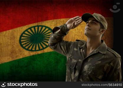 Soldier saluting with Indian flag in background