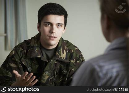 Soldier Suffering With Stress Talking To Counselor