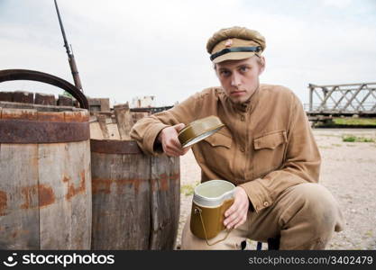 Soldier with a boiler in uniform of World War I. Costume accord the times of World War I. Photo made at cinema city Cinevilla in Latvia. Cockade on the hat do not contain trade mark.