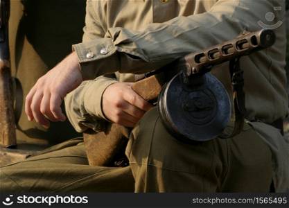 Soldier with drum machine gun in hand.. soldier