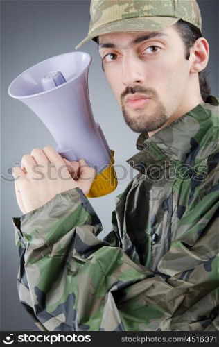 Soldier with loudspeaker shouting